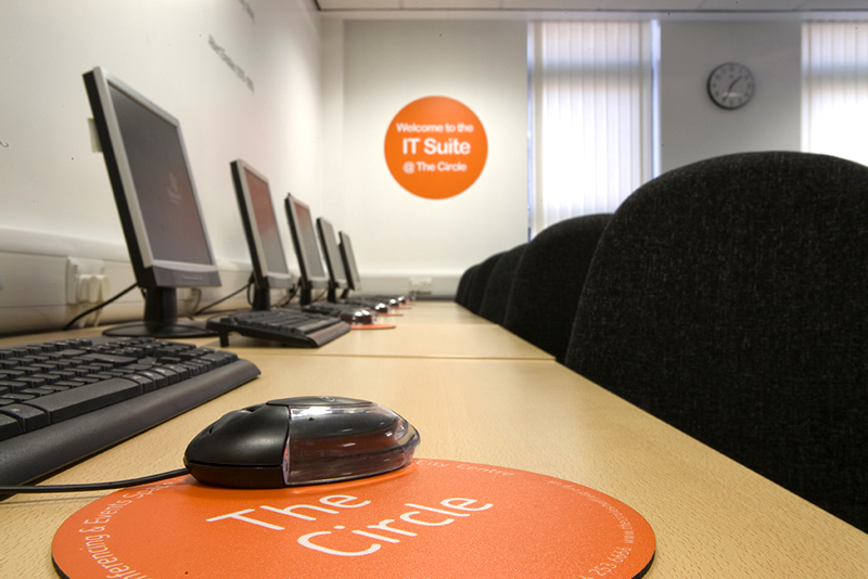A computer mouse positioned on a desk, highlighting its modern design and functionality in a workspace setting.